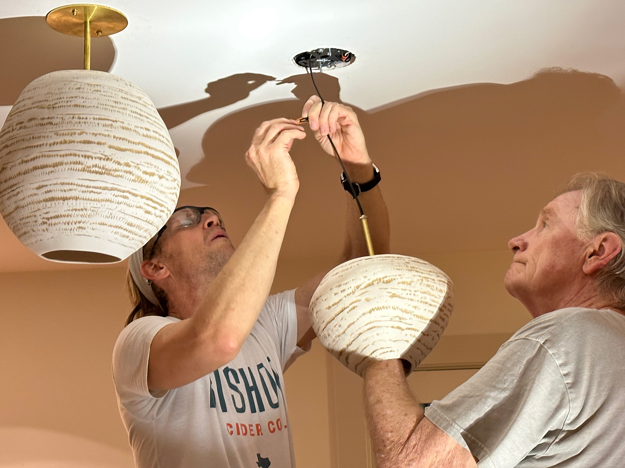 installing porcelain lights created by Lisa Ehrich